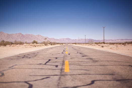 Asphalt Road Under the Clear Blue Skies during Daytime