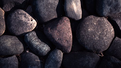 Close-up of Dark Stones on the Ground 