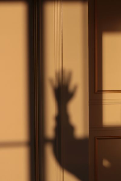 Shadows falling across a plaster wall — Yusra Mizgin Günay on Pexels