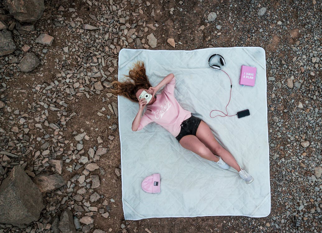 Free Top View Photo of Woman Lying on Mattress Stock Photo