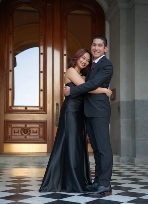 Smiling Couple in Black Dress and Suit