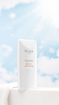 Elegant skincare product photo featuring blue sky background, ideal for beauty advertisements.