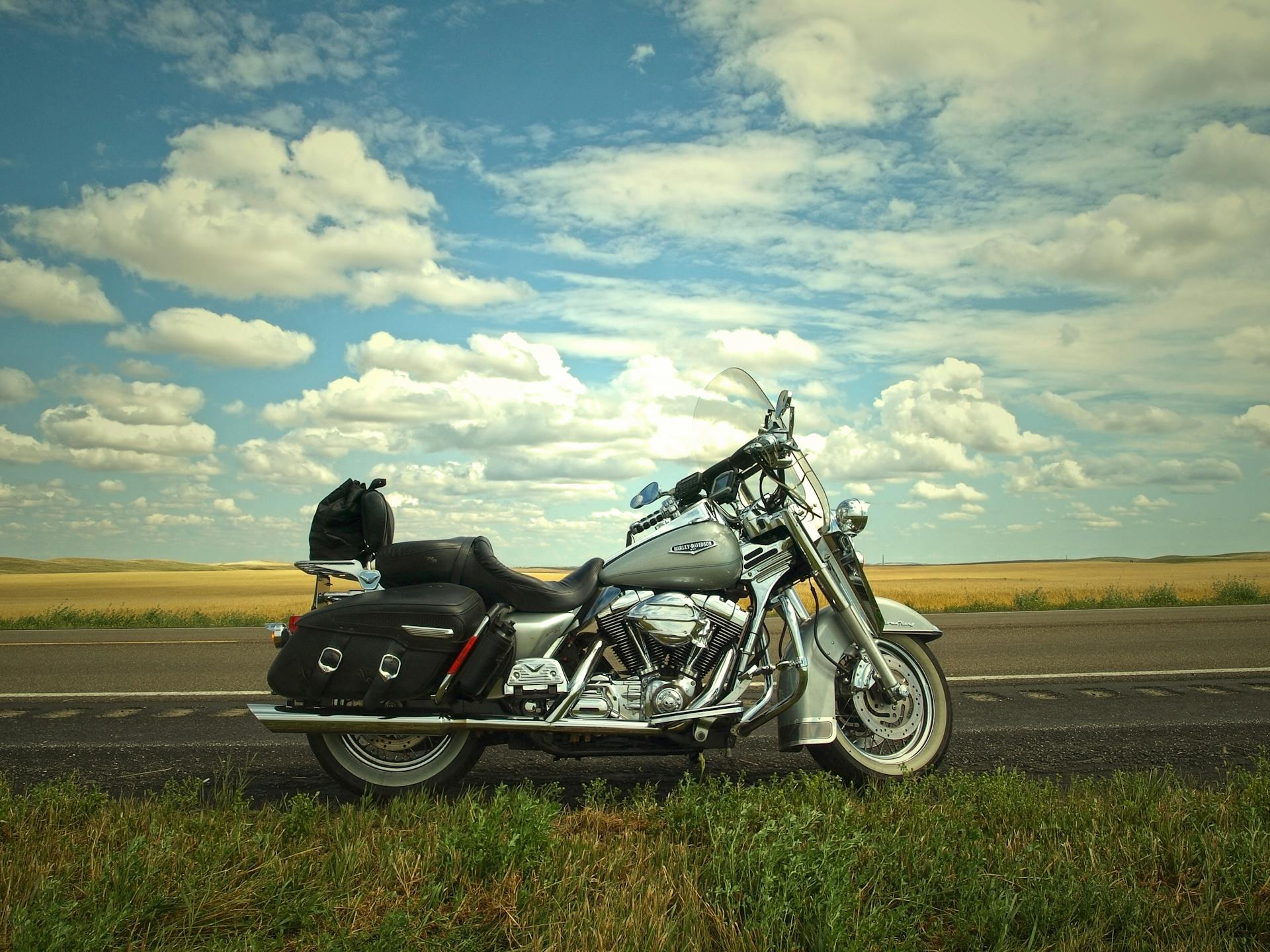 Gray and Silver Cruiser Motorcycle Near Green Grass Lawn