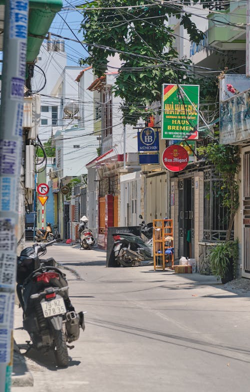 Scooters Parked in front of Buildings in City 