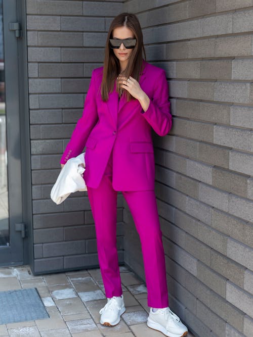 Woman in Pink Suit and Sunglasses