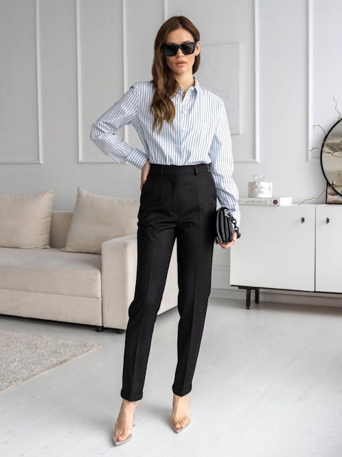 Woman in Shirt and Sunglasses in Room