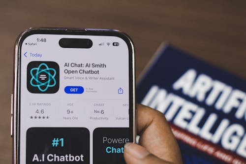 Free Webpage of Ai Chatbot, a prototype AI Smith Open chatbot, is seen on the website of OpenAI, on a apple smartphone. Examples, capabilities, and limitations are shown. Stock Photo