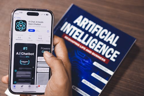 Free Webpage of Ai Chatbot, a prototype AI Smith Open chatbot, is seen on the website of OpenAI, on a apple smartphone. Examples, capabilities, and limitations are shown. Stock Photo