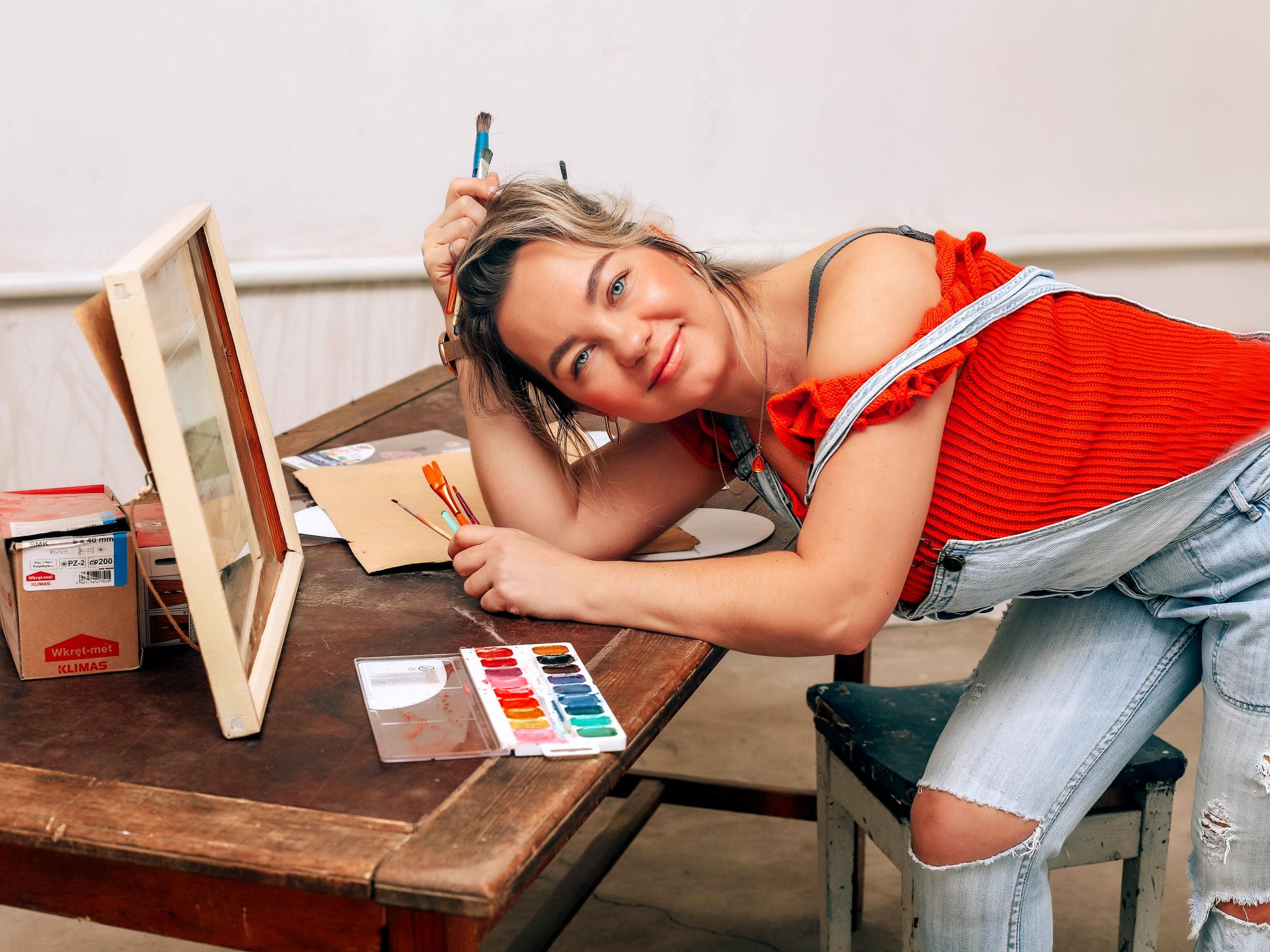 Painters & Decorators in Putney, London — professional decorator painting a wall with a roller
