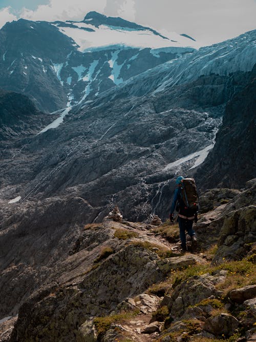 Person Hiking in Mountains