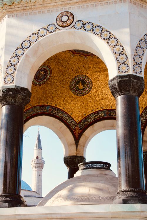 Free Stunning view of Ottoman-style arches and minaret in Istanbul, Turkey. Stock Photo