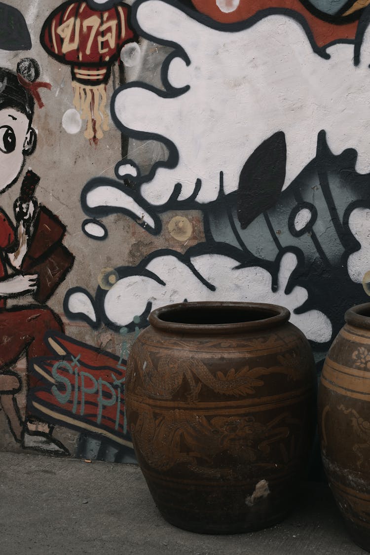 Jug By Wall On Street In Bangkok, Thailand