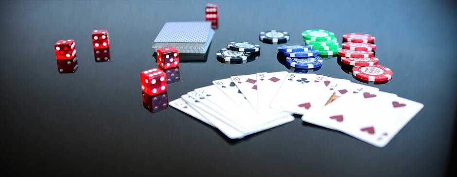 Playing Cards Beside Poker Chips and Dice