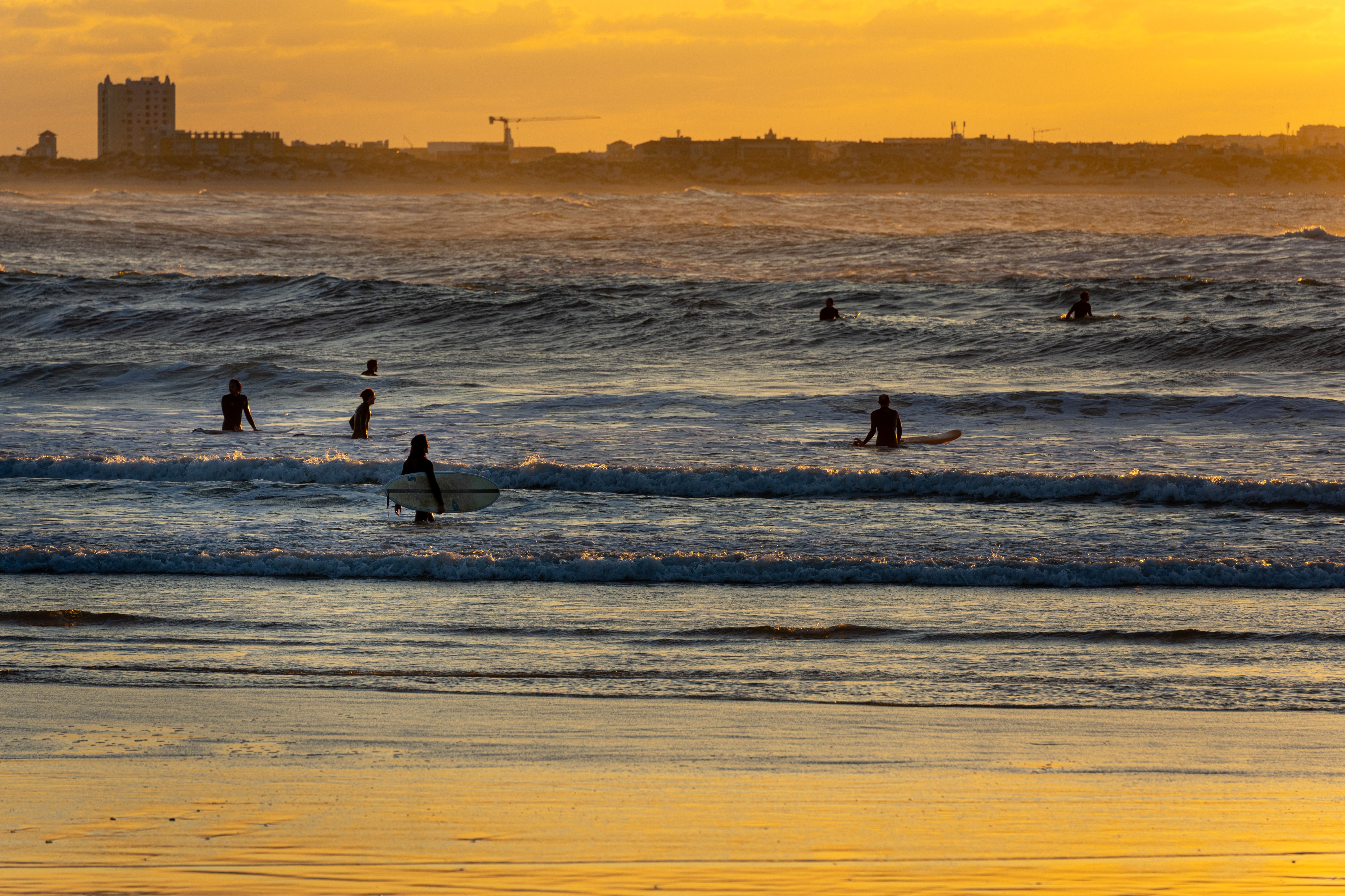 Surfboards racked outside a guesthouse near Surfers Corner in Muizenberg at dawn