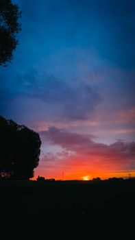Captivating sunset scene with vibrant sky colors and tranquil silhouettes, perfect for scenic backgrounds.