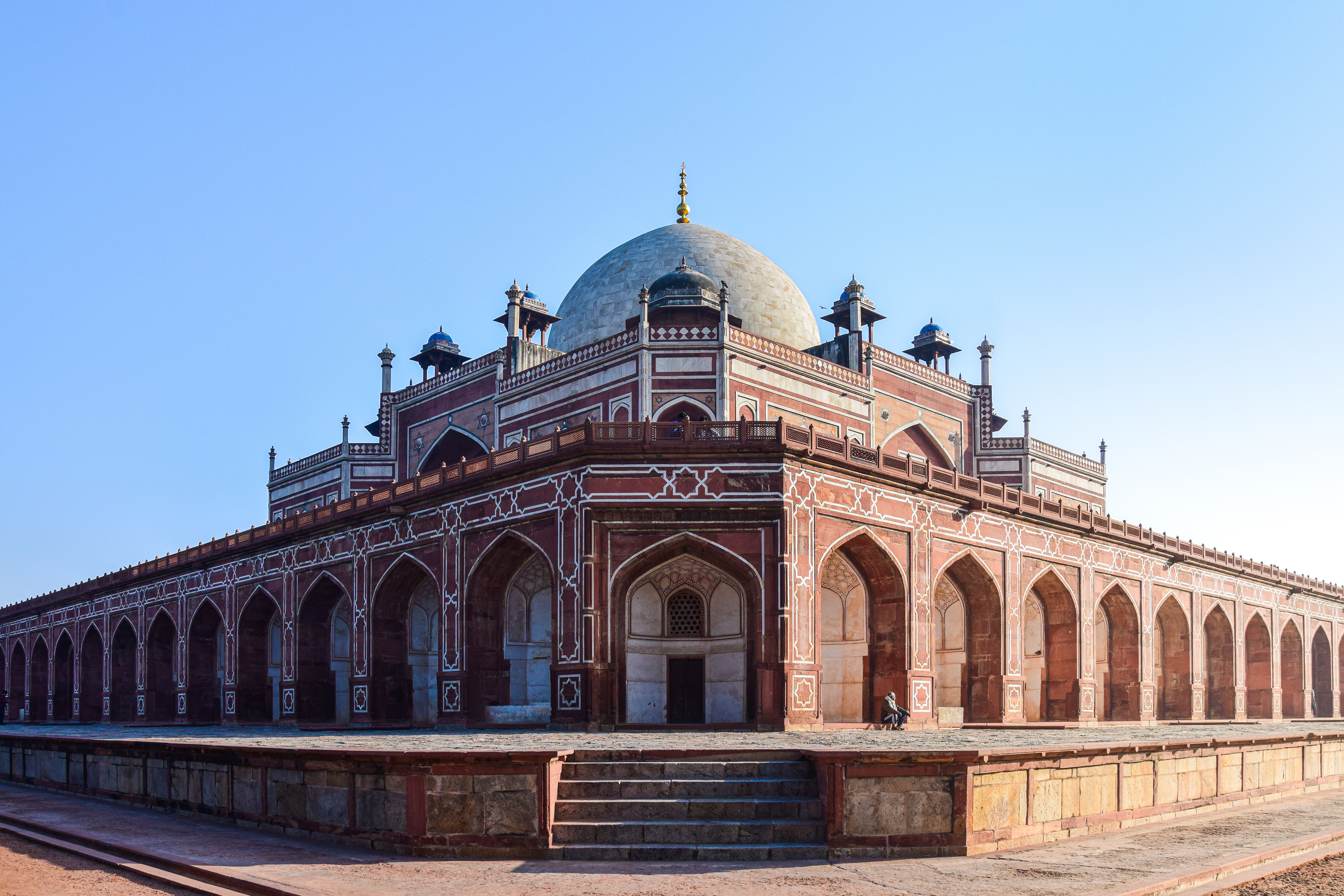 Historic Humayun's Tomb in New Delhi, India, showcasing Mughal architecture under a clear blue sky.