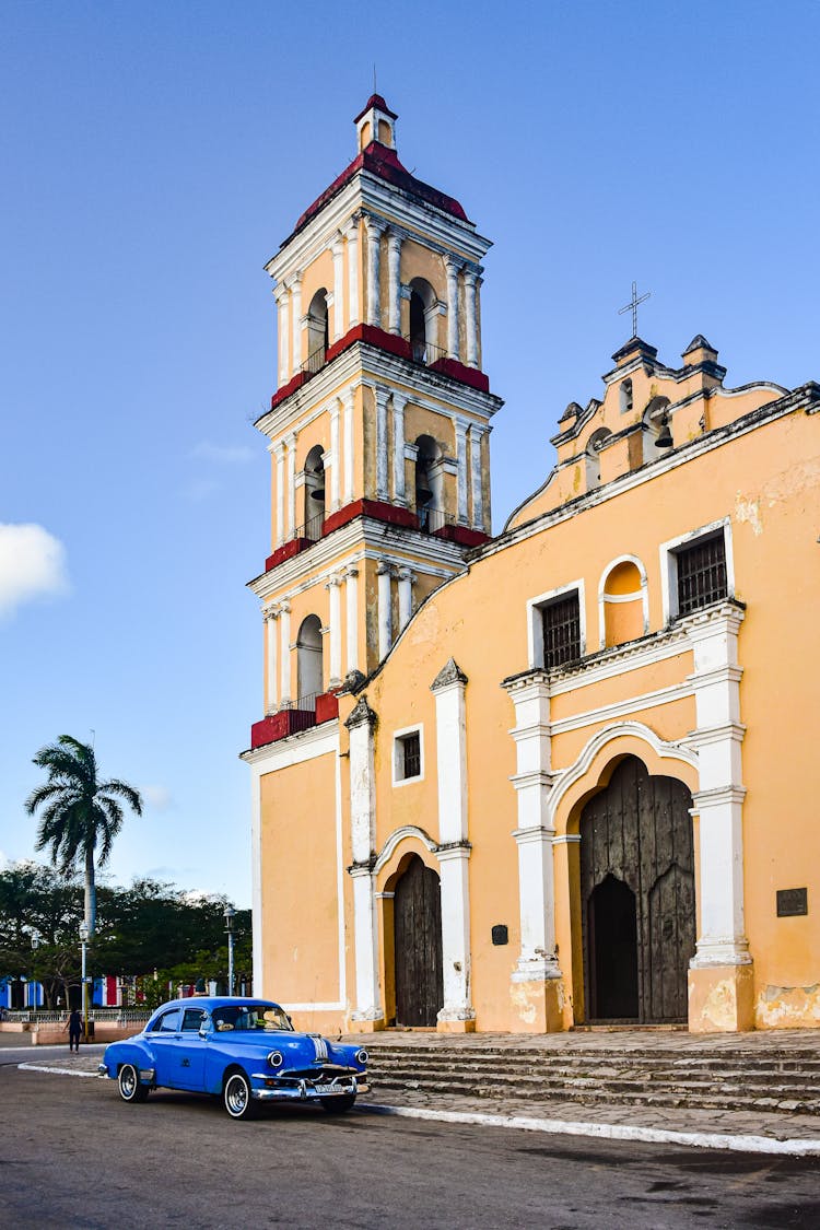 Vintage Car Parked Near Church In Cuba