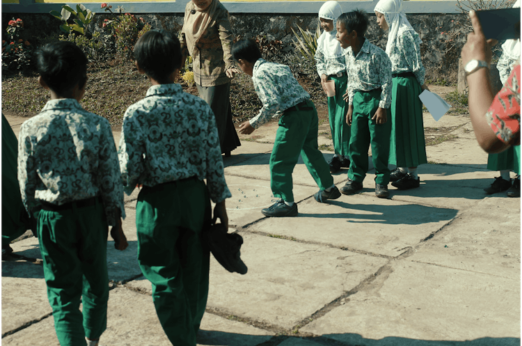 Boys And Girls Playing On Pavement