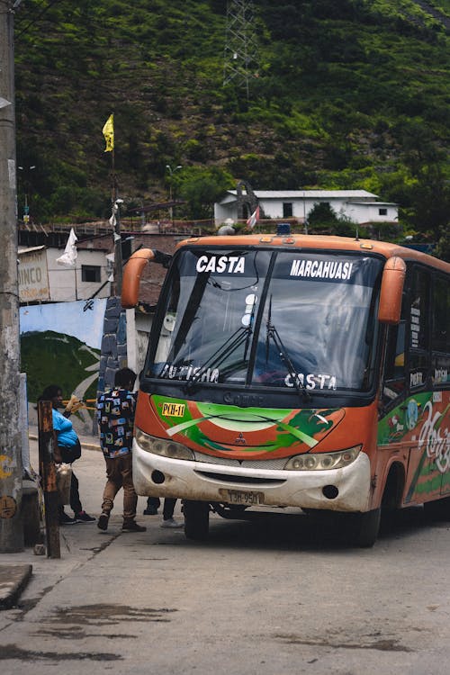 Bus on Road in Village
