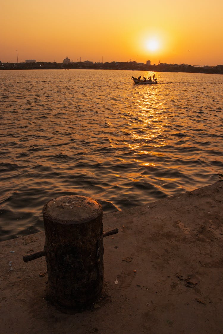 Post On Pier At Sunset