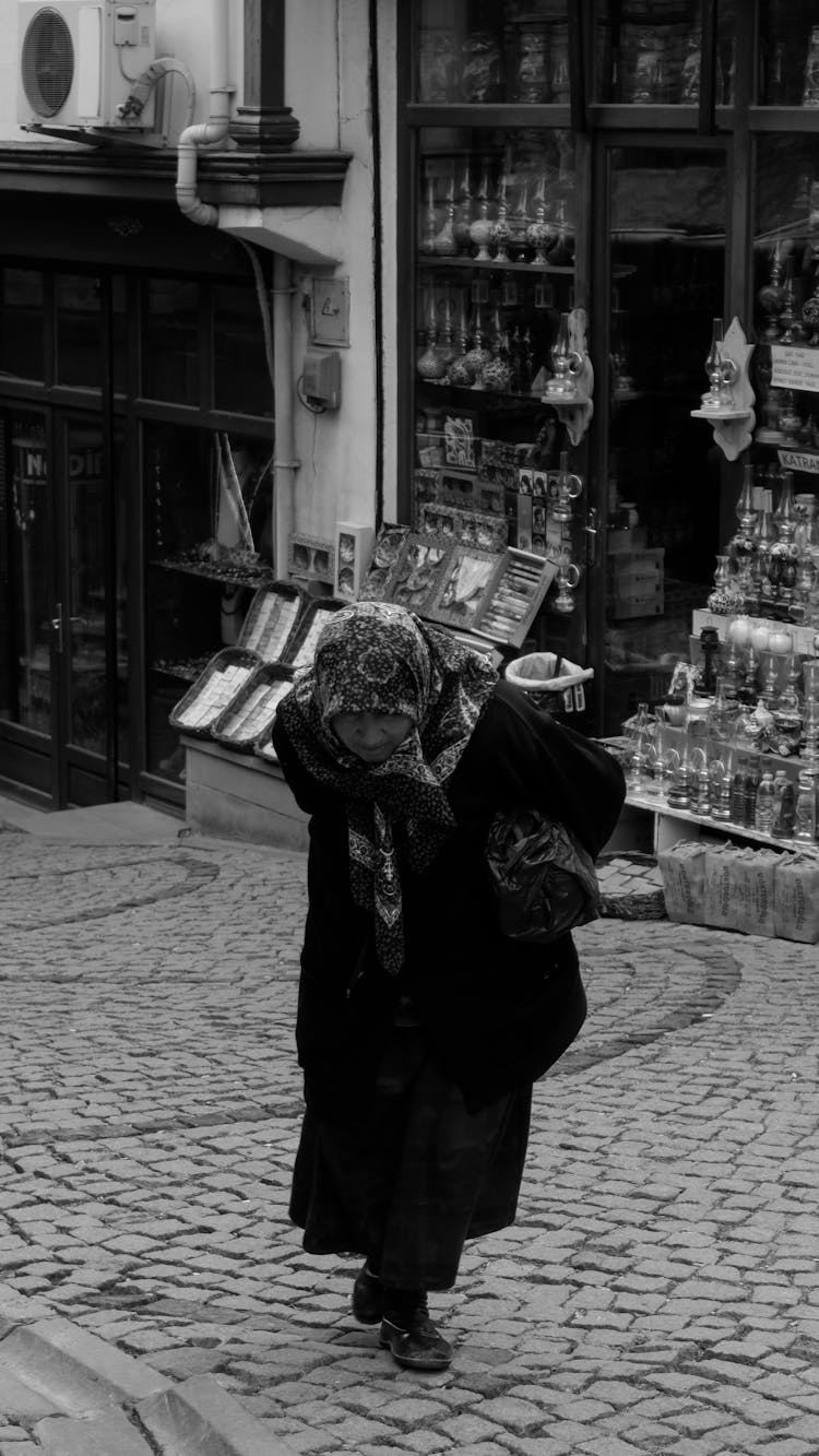 Elderly Woman On Street In Town