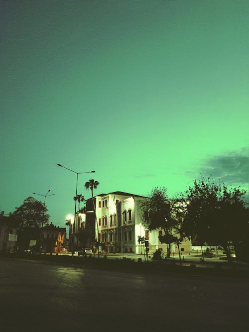 Green Sky over Building in Town