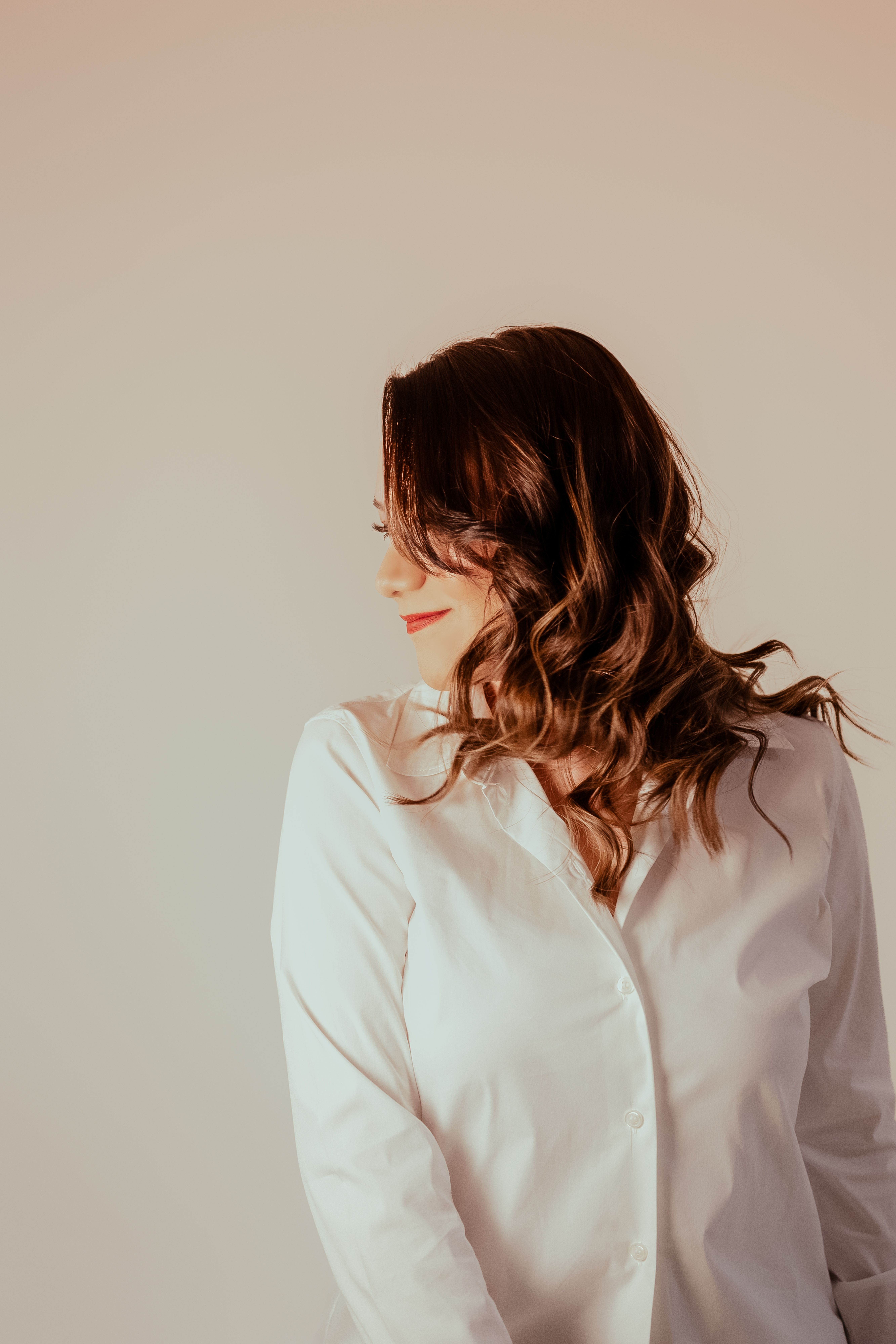 Brunette Woman in White Shirt Posing by Window · Free Stock Photo