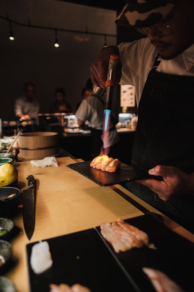 Man Preparing Sushi In A Restaurant 