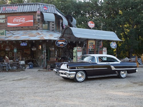 Black Mercury Montclair Car near Building in Village in USA
