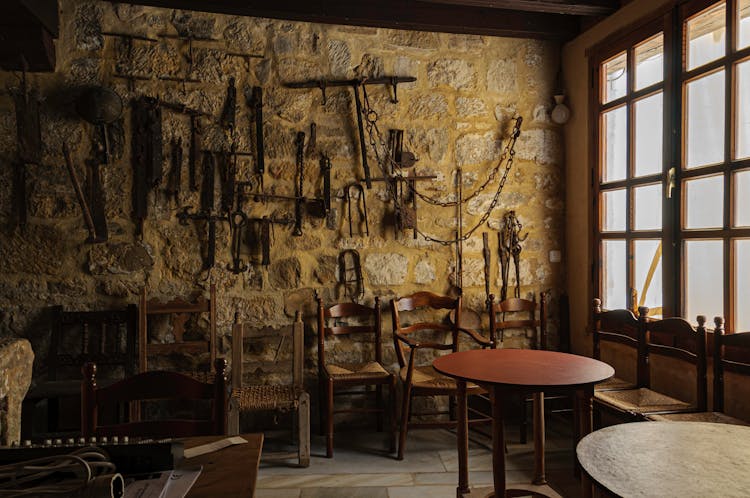 Table And Tools On Stone Wall In Room