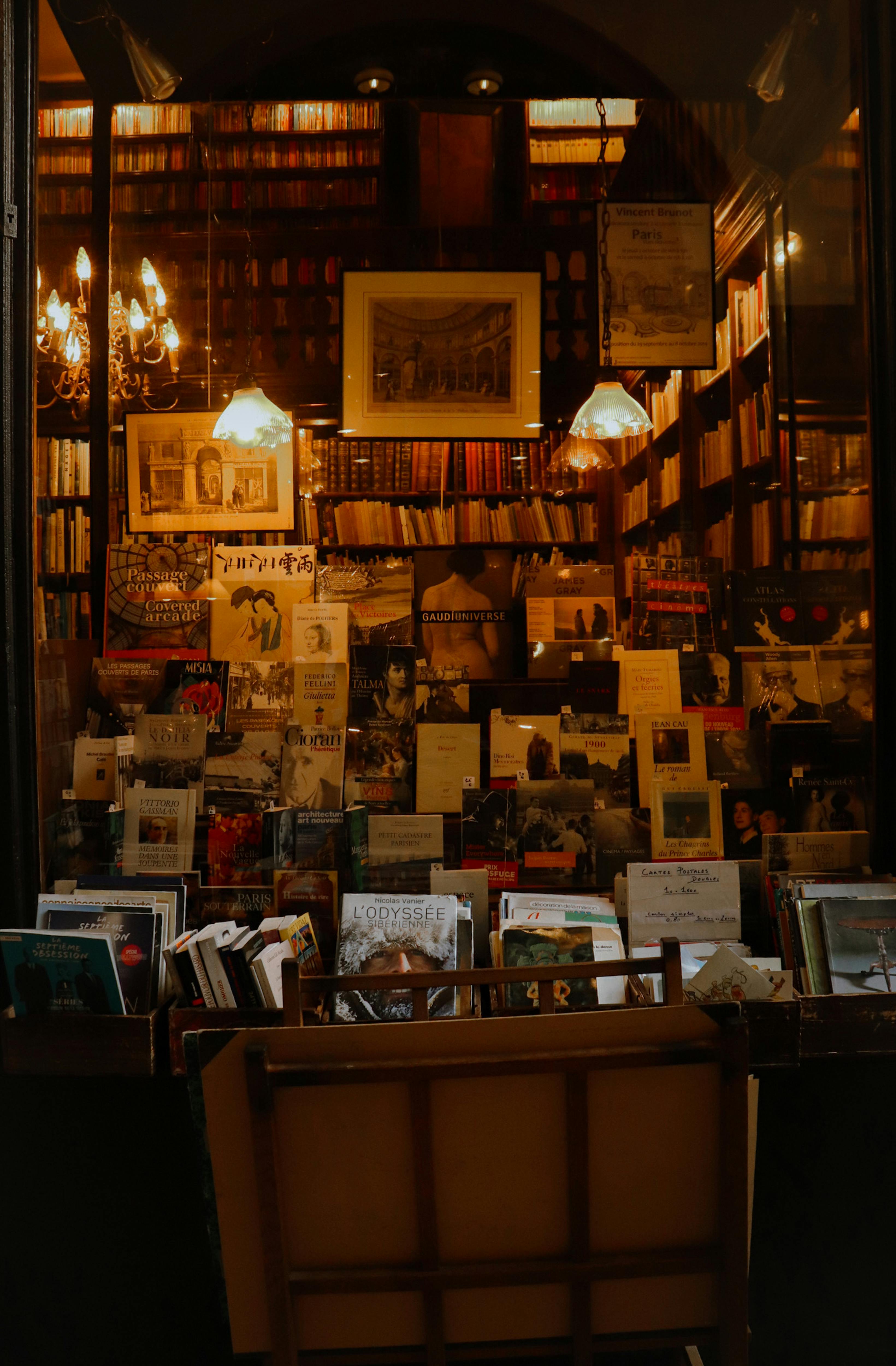 a book store with books and a window