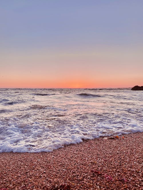 Clear Sky over Sea Shore at Sunset