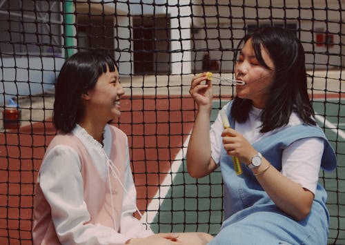 Girls Blowing Bubbles