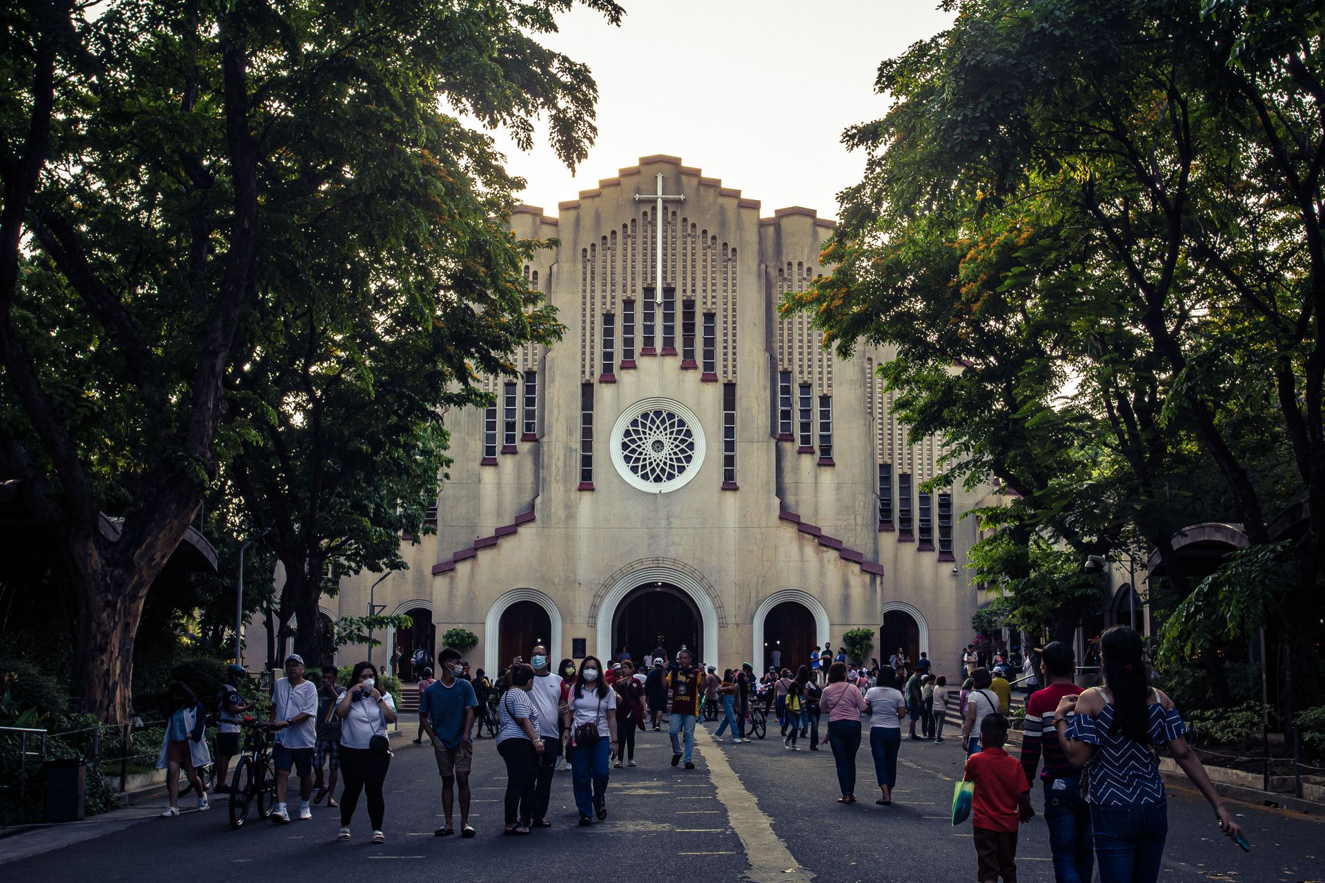 Crowd in front of St. Andrew's Cathedral, Parañaque, NCR, Philippines, during daytime.