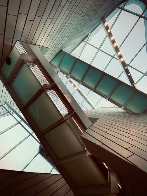 Free A captivating view of modern architecture featuring an abstract design and glass ceiling. Stock Photo