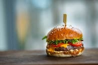 Photo of Juicy Burger on Wooden Surface