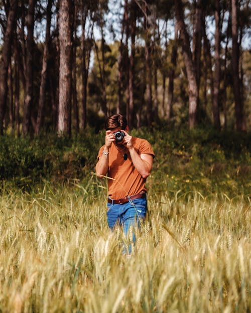 A Photographer Standing on a Field 