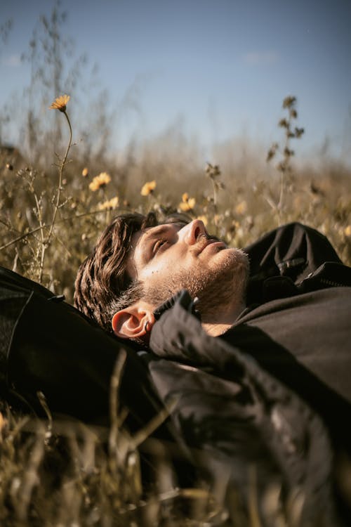 Man Lying Down on Meadow