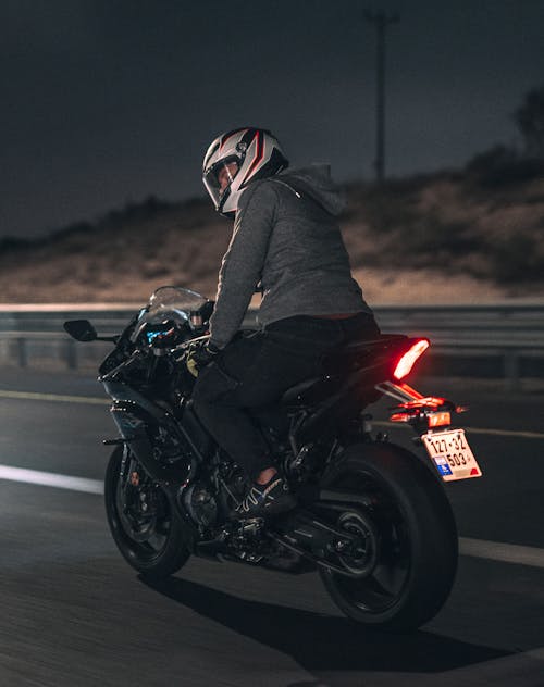 Man Riding on a Motorcycle at Night 