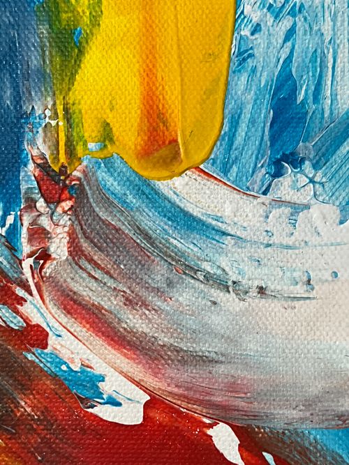 Free Dynamic abstract painting with vivid yellow, blue, red brushstrokes. Stock Photo