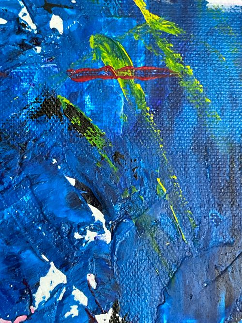 Free Close-up of a vibrant abstract painting with bold blue and green brushstrokes. Stock Photo
