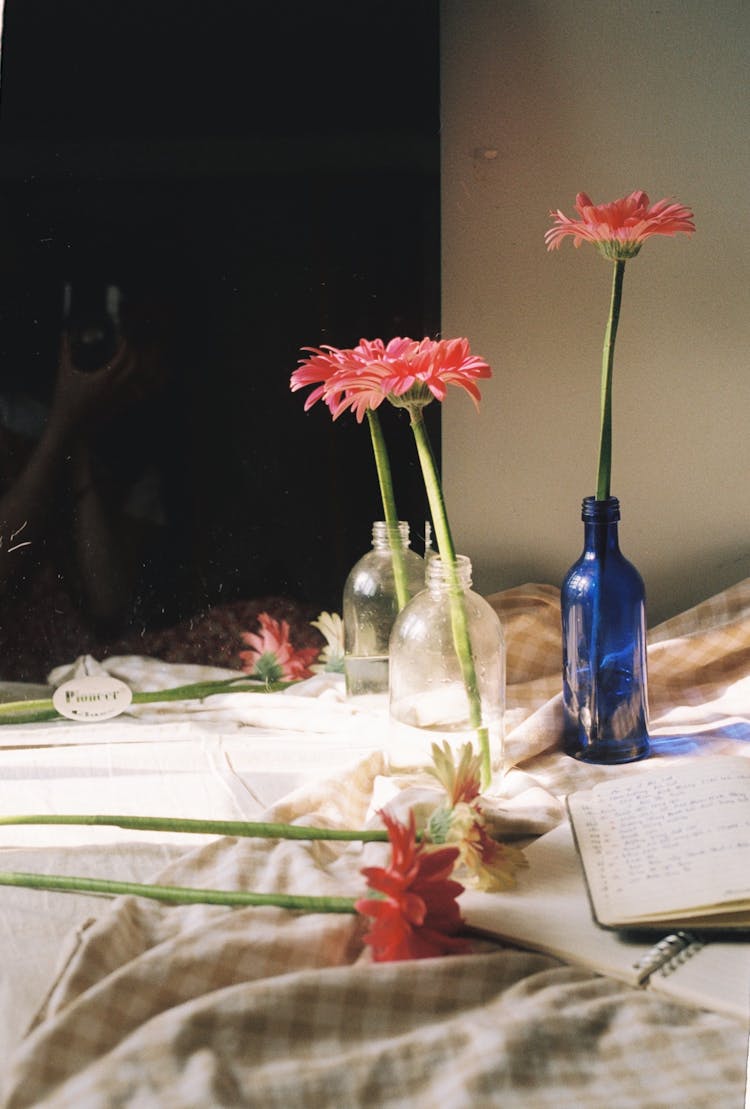 Flowers And Books On A Bed