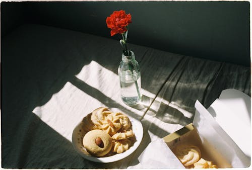 Cookies on Plate and Flower in Vase in Light 