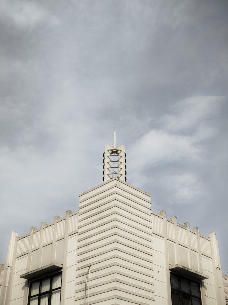 Stone Building Against Cloudy Sky