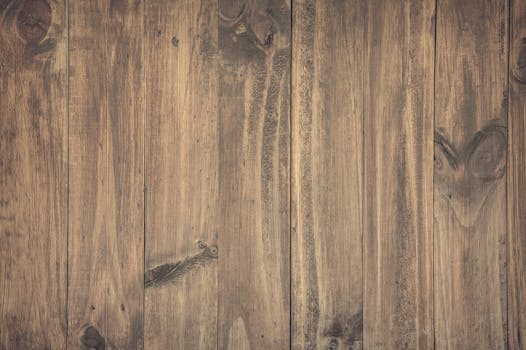 High-resolution image of rustic wooden planks with detailed grain texture, perfect for backgrounds.