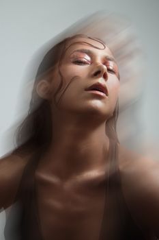 A dynamic and creative portrait of a woman with a motion blur effect, featuring a modern artistic style.