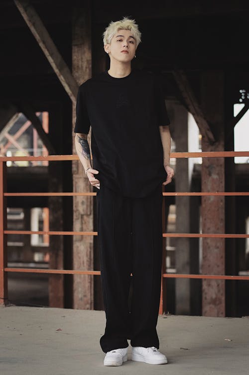 Man with Dyed Hair Posing in Black Clothes