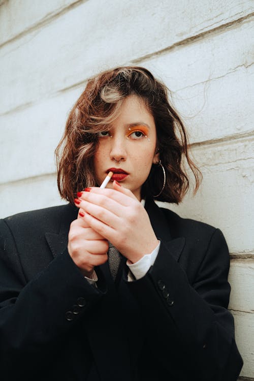 Photo of a Young Woman Smoking Cigarette