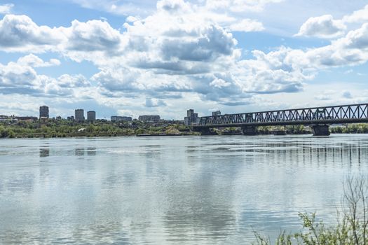 A scenic urban view of Pančevo Bridge over the Sava River in Belgrade, Serbia.