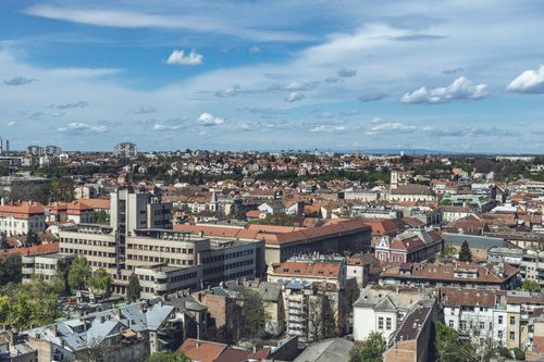 Free A panoramic aerial view of the old town in Belgrade, Serbia. Captures the city's architectural charm under a clear blue sky. Stock Photo